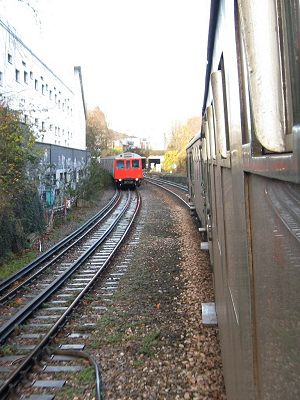 Passing a Distric Line train on the way to Kensington Olympia